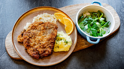 Pork breaded cutlet coated with breadcrumbs with mashed potatoes