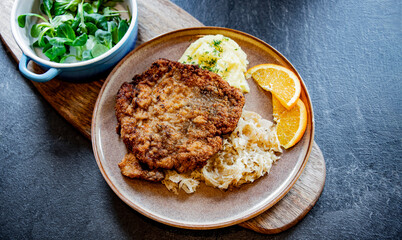 Pork breaded cutlet coated with breadcrumbs with mashed potatoes