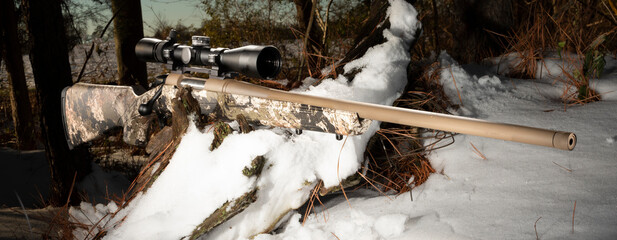 Bolt action rifle in a snowy forest - obrazy, fototapety, plakaty