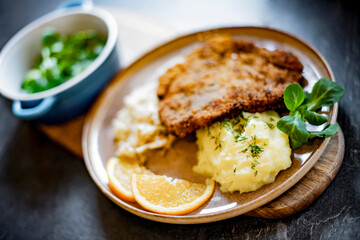 Pork breaded cutlet coated with breadcrumbs with mashed potatoes