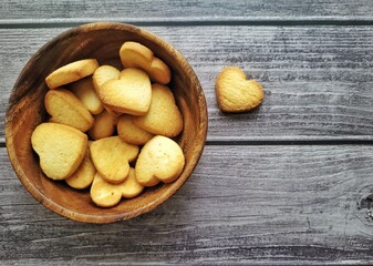 homemade cookies hearts on a wooden background in a plate.  valentines day holiday concept  . top view.