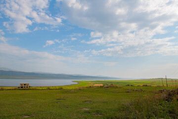 spacious landscape on the field with clouds