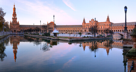 Obraz premium scenic view of Plaza de España The Plaza de España is a plaza in the Parque de María Luisa, Historical landmark in Seville sunset, Spain
