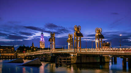 A modern drawbridge illuminated during the blue hour in the city of Kampen in the Netherlands