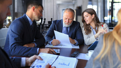 Business people working on new project at modern office.