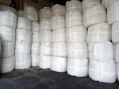 Stock pile Chemical fertilizer jumbo-bag in warehouse waiting for shipment.	