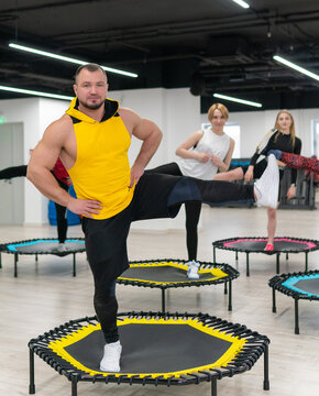 Women's and men's group on a sports trampoline, fitness training, healthy life - a concept trampoline group batut girl healthy, from female activity in fitness and sport person, wellness happiness