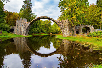 Fototapeta na wymiar The bridge reflection in the water
