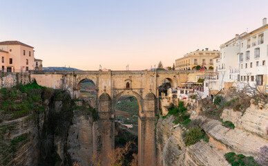 Fototapeta na wymiar Panoramic view of the old city of Ronda, one of the famous white villages, at sunset in the province of Malaga, Andalusia, Spain