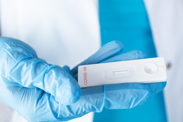 lateral flow test,coronavirus cassette in the hand of a doctor in medical gloves