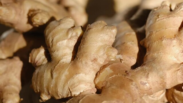 Whole ginger root on close up rotating 4K