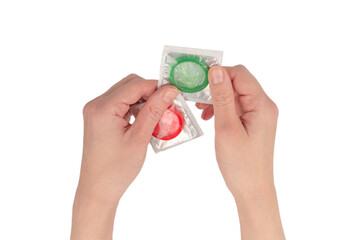 Condom in woman hand isolated on white background.