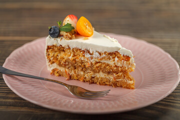 Carrot-orange cake for diabetics decorated with fresh fruit and mint