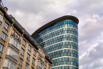 Fototapeta na wymiar Modern office skyscraper next to an old residential building in Brussels, Belgium