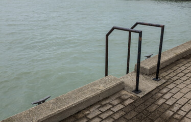 Concrete embankment with swim ladder