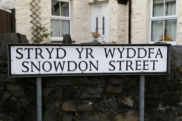 Fototapeta na wymiar Llanberis, Gwynedd, Wales, UK. January 21, 2022. A close up view of Snowdon Street road sign. 
