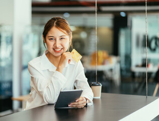 Young woman with tablet in coffee shop.