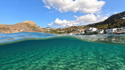 Obraz premium Underwater split photo taken from beautiful emerald bay and beach of Kapsali, Kythira island, Ionian, Greece