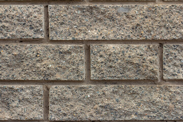Gray stone wall. A fragment of a wall made of brick and mortar .Space for the text.