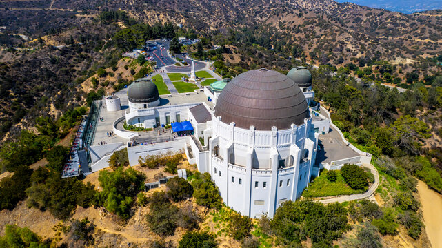 Beautiful observatory building nestled in the hills. Scenic California landscape. Bright sunny day.  Los Angeles' Griffith Park.
