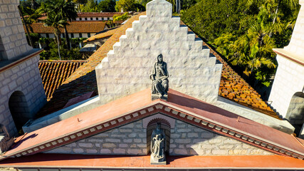 Fototapeta na wymiar Statues on the roof of the Historic Spanish Mission of Santa Barbara in California, USA 2022. photo from the drone
