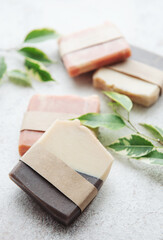 Handmade soap bars and green leaves