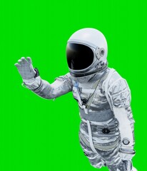 Astronaut isolated on green background. © Charlie