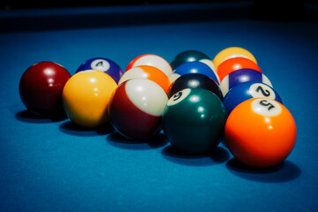 Pool game - balls in triangular shape on a table