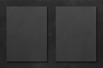 Black rectangular mockups on a dark concrete background. Design elements or portfolio. Copy space