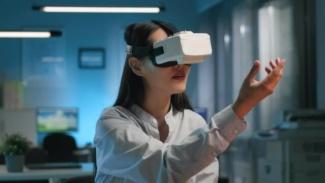Young businesswoman engineer working on project in vr headset