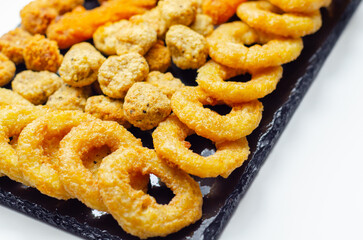 Southern fried and roast chicken bites, onion rings and mozzarella stick served on the stone plate