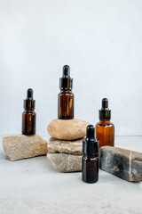 Glass dropper bottles with pipette. Cosmetic oil bottle mockup. Mockup scene. Product presentation concept.
