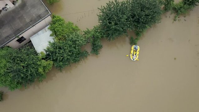 GALYCH, UKRAINE - JUNE 24, 2020: Flooded neighborhood street. Major flooding leaves city, underwater, entire community. Homes, houses overflowing water, insurance needed. helping people Aerial View