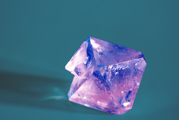Natural crystal of the mineral corundum on a blue background