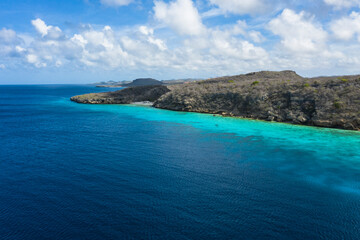 Aerial view of coast scenery with the ocean, cliff, and beach around Porto Mari  area, Curacao,...