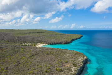 Fototapeta na wymiar Aerial view of coast scenery with the ocean, cliff, and beach around Porto Mari area, Curacao, Caribbean