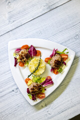 minced veal steaks with mashed potatoes and salad