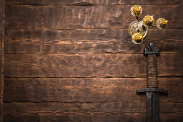 Old knight sword and the flat lay table background with copy space.