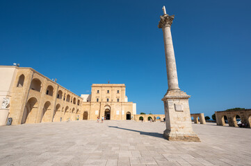 Santa Maria di Leuca, Puglia, Italy. August2021. The sanctuary is located on the lighthouse hill overlooking the bay. In the center of the square an obelisk. Beautiful summer day.