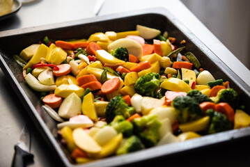 chopped vegetables laid out on an oven sheet