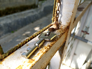 Close up the Amano's key on the iron fence.
