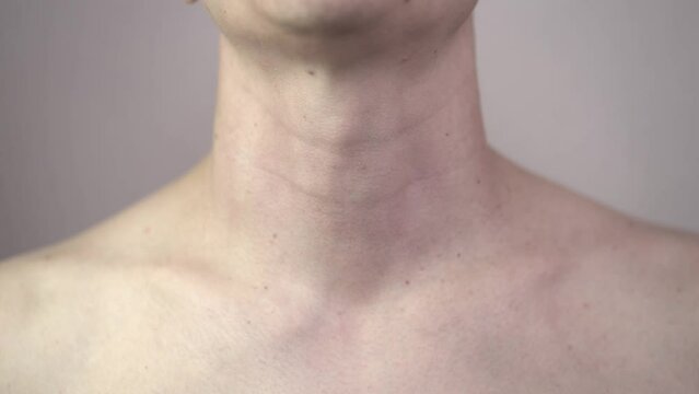 Sore throat and cough, man with pain in neck at home, health problems concept