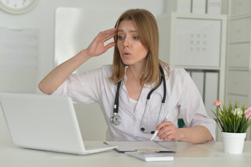 Portrait of smiling female doctor in hospital