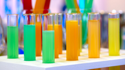 Scientist working with chemical reaction in chemistry laboratory. close up of scientist making research in lab, chemical molecular on blue chemistry science laboratory background