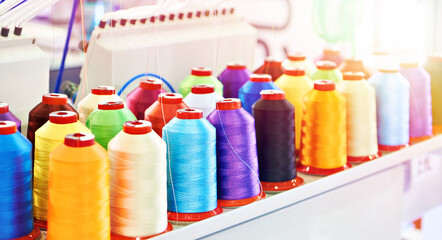 Bobbins with colored thread for industrial textile