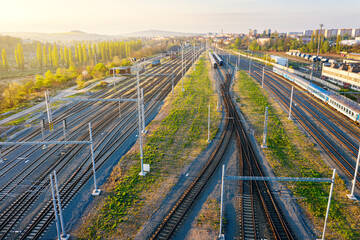 Fototapeta na wymiar Railway station with wagons during sunrise from above