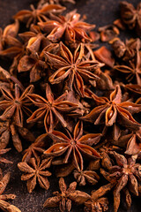 Anise stars herbs on rustic old table.