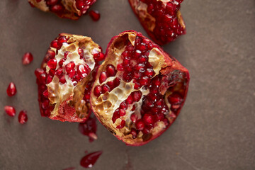 Pomegranate seeds on marble background 