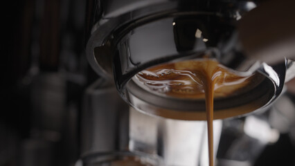 closeup espresso extraction from naked portafilter