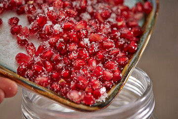 Mixed sugar and pomegranate on a plate